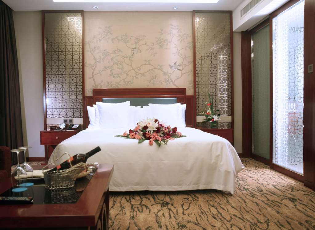 Gloria Grand Hotel Wuxi Уси Стая снимка